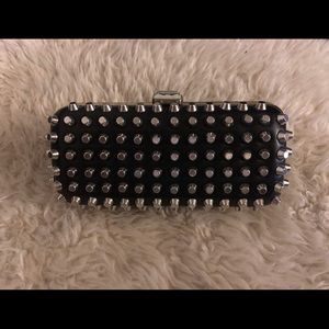 Studded clutch with snap closure.